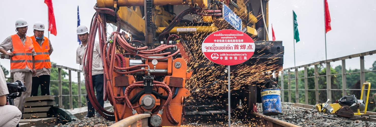 Workers from China Railway No.2 Engineering Group (CREC-2) weld the first seamless rails for the China-Laos railway in the northern suburb of Vientiane, Laos, on June 18, 2020