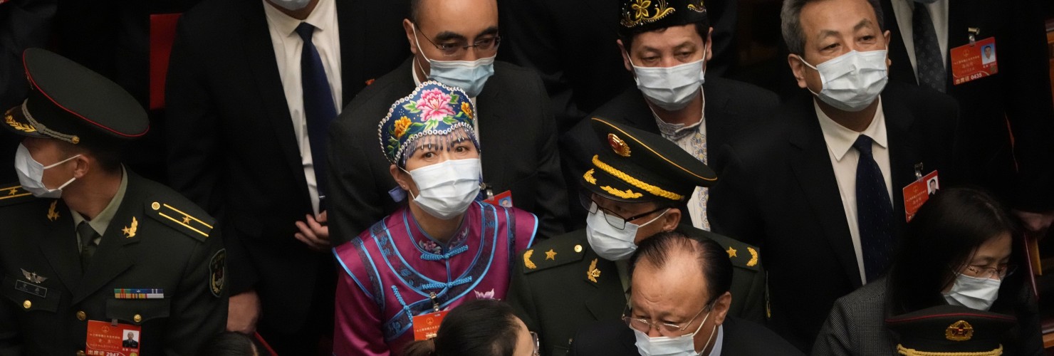 Delegates leave after the closing session of China's National People's Congress (NPC)