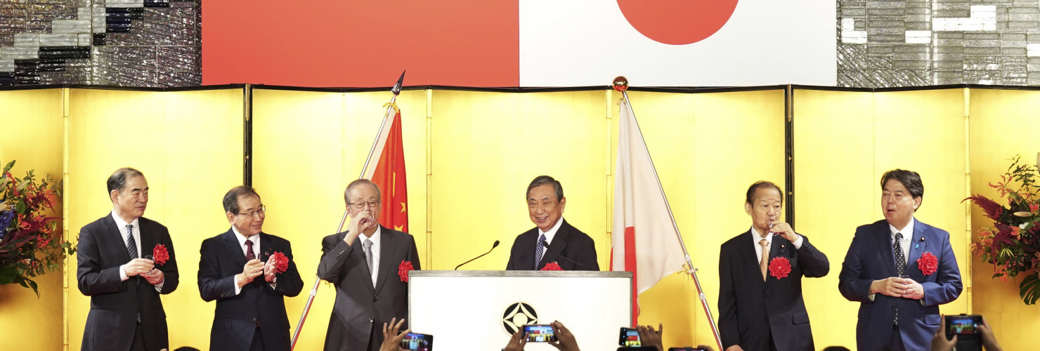 On the stage from left, the Chinese ambassador to Japan Kong Xuanyou, Chairman of the Japan Business Federation Masakazu Tokura, former Japan's Prime Minister Yasuo Fukuda, Head of the Japanese Association for the Promotion of International Trade Yohei Kono, Japan's ruling Liberal Democratic party's politician Toshihiro Nikai and Japanese Foreign Minister Yoshimasa Hayashi toast during a reception to mark the 50th anniversary of Japan-China diplomatic relations Thursday, Sept. 29, 2022, in Tokyo.