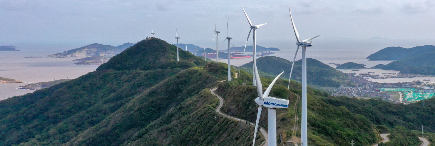 An aerial photo shows wind turbines turning under the action of sea breeze at Qushandao Wind Farm in Zhoushan City, Zhejiang Province, China, Nov 1, 2022.