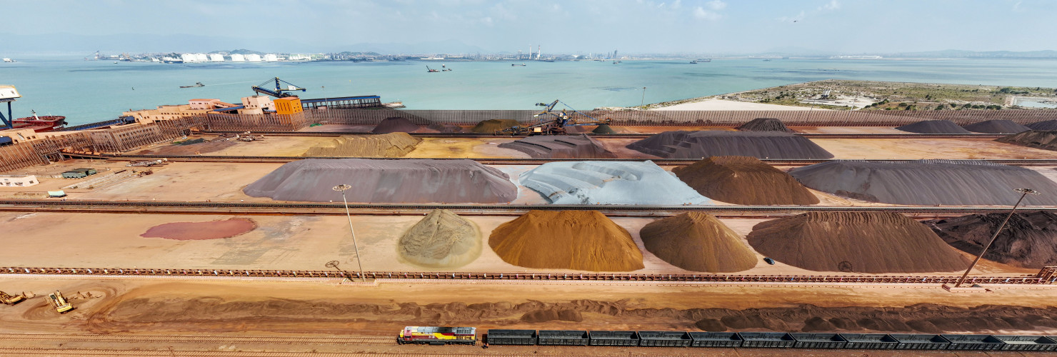 A train pulls into Dongwu port District to carry an inbound iron ore unloaded by a foreign ship in Putian, Fujian province, China, Sept 29, 2022