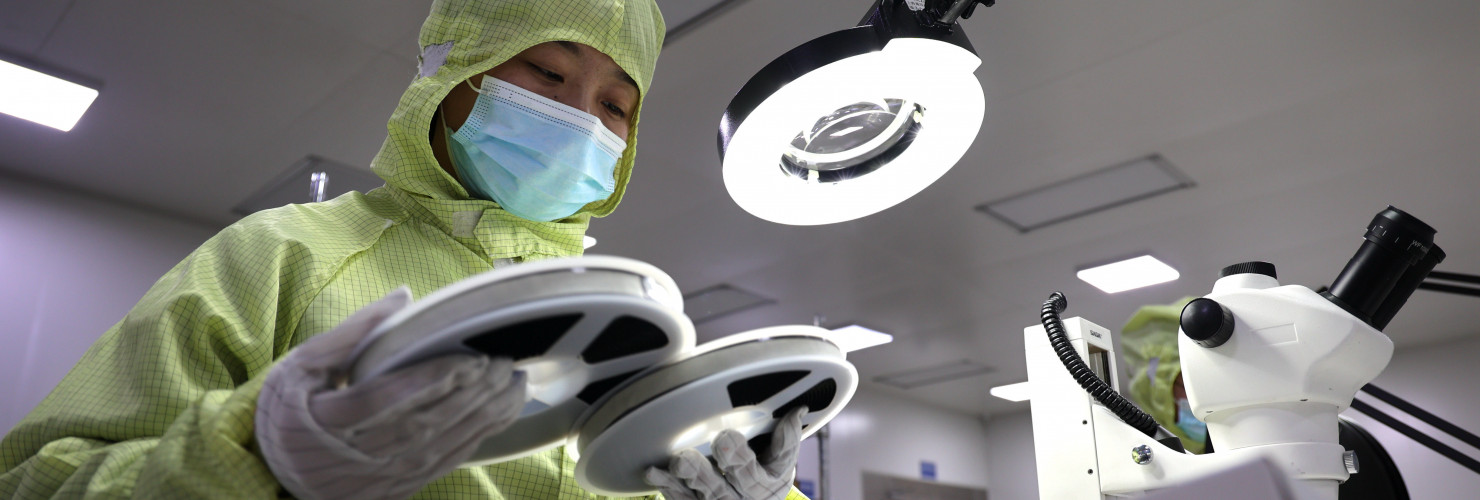 A worker produces semiconductors at a workshop of a semiconductor manufacturer in Binzhou, East China's Shandong Province.