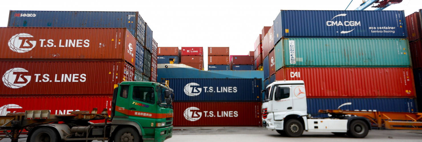 Cargoes and transport long vehicles are seen at a port in Keelung.