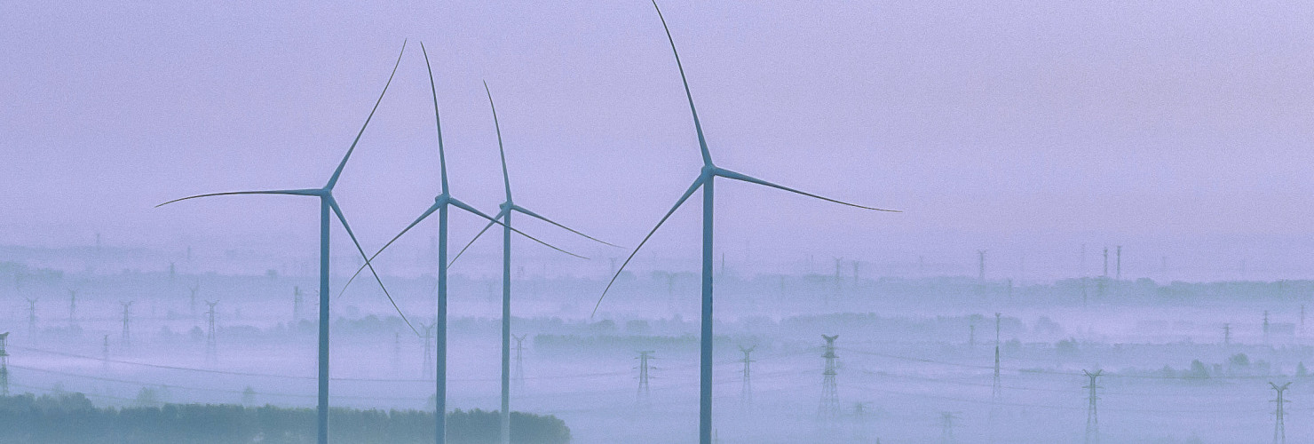 Wind turbines rotate as the sun rises in Zhengji village, Suqian City, Jiangsu Province, China, October 25, 2023.