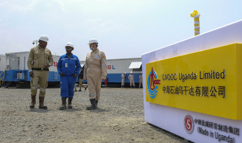 Ugandan and Chinese workers at an oil field in western Uganda