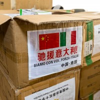 Boxes marked with Chinese and Italian flags containing face masks destined for Italy