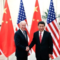 Chinese President Xi Jinping  shakes hands with US Vice President Joe Biden inside the Great Hall of the People in Beijing, China, 2013.