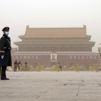 Police officers are seen at Tiananmen Square in Beijing