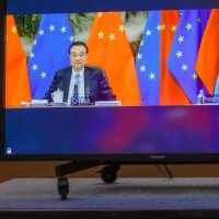 Chinese Premier Li Keqiang (L) and European Commission President Ursula von der Leyen (R) speak via video-conference with European Council President Charles Michel, and European Union foreign policy chief Josep Borrell, during an EU China summit at the European Council building in Brussels, Belgium