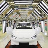 Employees work on the assembly line of Neta electric car at a factory of Hozon New Energy Automobile Co., Ltd on February 19, 2021 in Jiaxing, Zhejiang