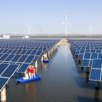 Power workers inspect photovoltaic power generation facilities at a 35-MEGAwatt "fish-light complementary" photovoltaic power station in Binhai, Jiangsu, March 15, 2022