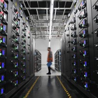 A worker maintains equipments at a cloud computing base under construction in Zhongwei City