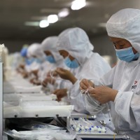 A worker rushes to produce an infusion device in a workshop of a medical device company in Pangjia Town, Boxing County, Binzhou City, East China's Shandong Province, April 12, 2022.