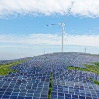 A wind-complementary power station is seen on a barren hill in Xuzhuang town, Shanting district of Zaozhuang, Shandong Province, China, Aug 26, 2022.