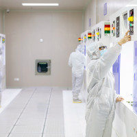 A worker makes and tests semiconductor power device chip products at a workshop of a microelectronics company in Binhai New Area, Hai 'an City, East China's Jiangsu Province, March 23, 2023.