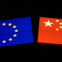 Flags of European Union and China displayed on screens