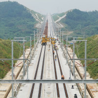 A track-laying train performs ballastless track-laying