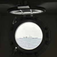 A Chinese coast guard ship blocks Philippine coast guard ship, BRP Sindangan as it tried to head towards Second Thomas Shoal at the disputed South China Sea during rotation and resupply mission on Wednesday, Oct. 4, 2023.