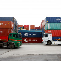 Cargoes and transport long vehicles are seen at a port in Keelung.