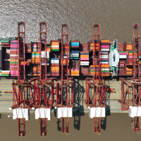  Ships carry out container loading and unloading operations at the Dapukou container Terminal at Zhoushan Port, Zhejiang province, China, April 9, 2024.