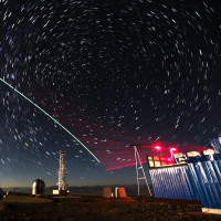 This composite photo taken on Dec. 9, 2016 shows a satellite-to-earth link established between quantum satellite "Micius" and the quantum teleportation experiment platform in Ali, Tibet Autonomous Region.