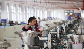 A worker assembles a badminton ball in a production base in Jinping County, Guizhou Province. 