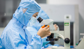 A worker prepares an order for export light filters at a workshop in Nantong, Jiangsu province, China.