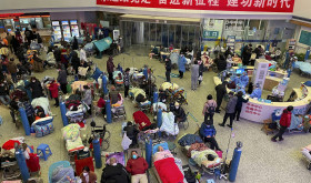 Patients, most of them elderly with covid symptoms, are crowded at the Changhai Hospital hall as they receive medical treatment, in Shanghai, China, Tuesday, Jan. 3, 2023