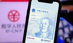 A mobile phone displays a E-CNY currency interface in Yichang, Hubei Province, Feb 9, 2022.